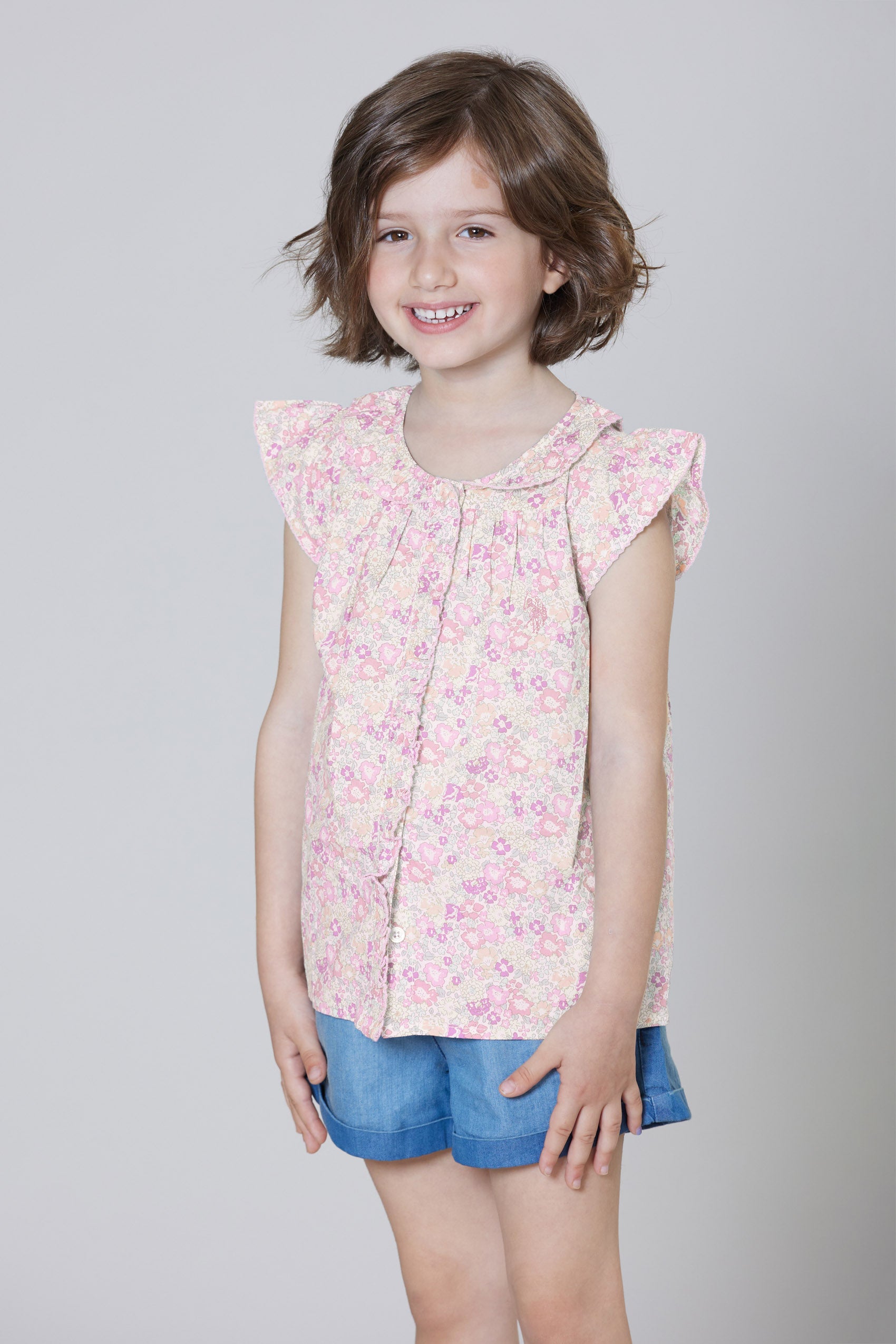 Camicia smanicata in cotone popeline con fantasia floreale