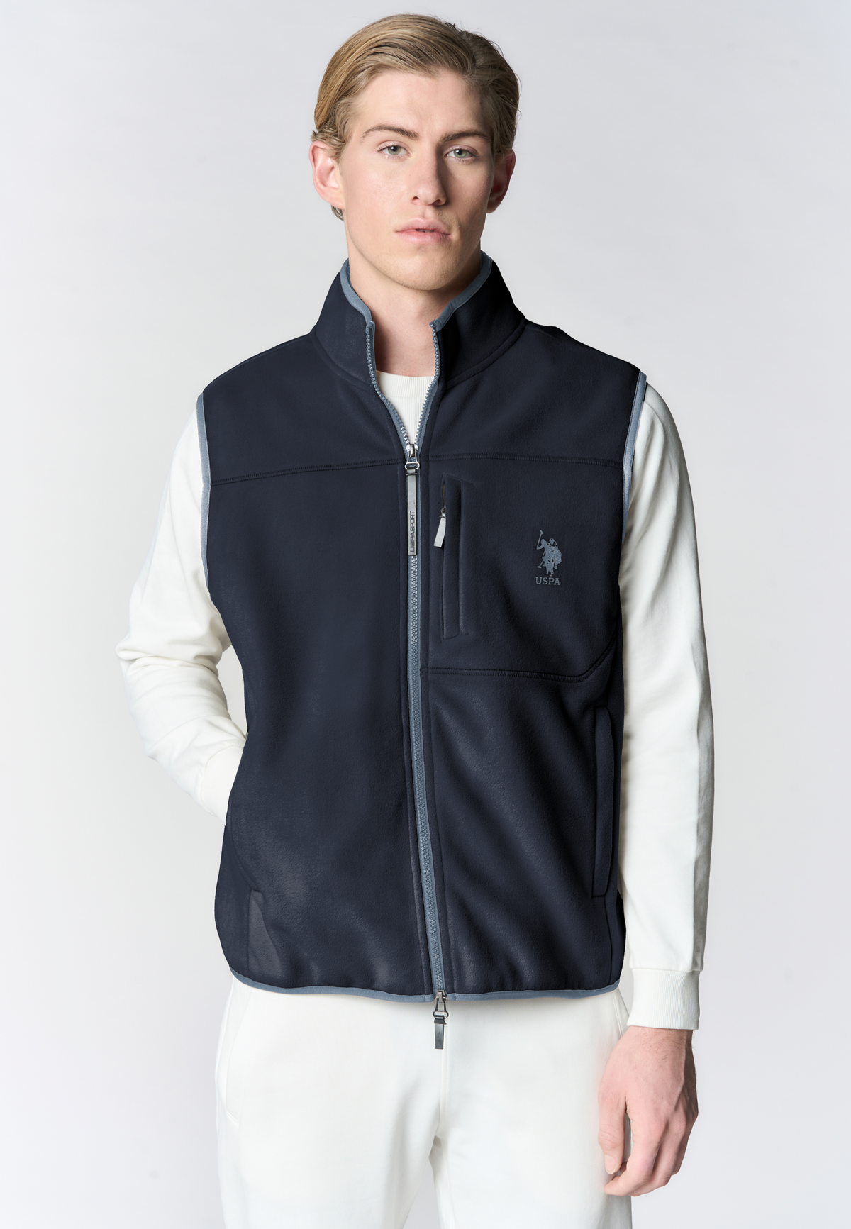 Gilet in pile bicolore con collo alto e tasche con zip