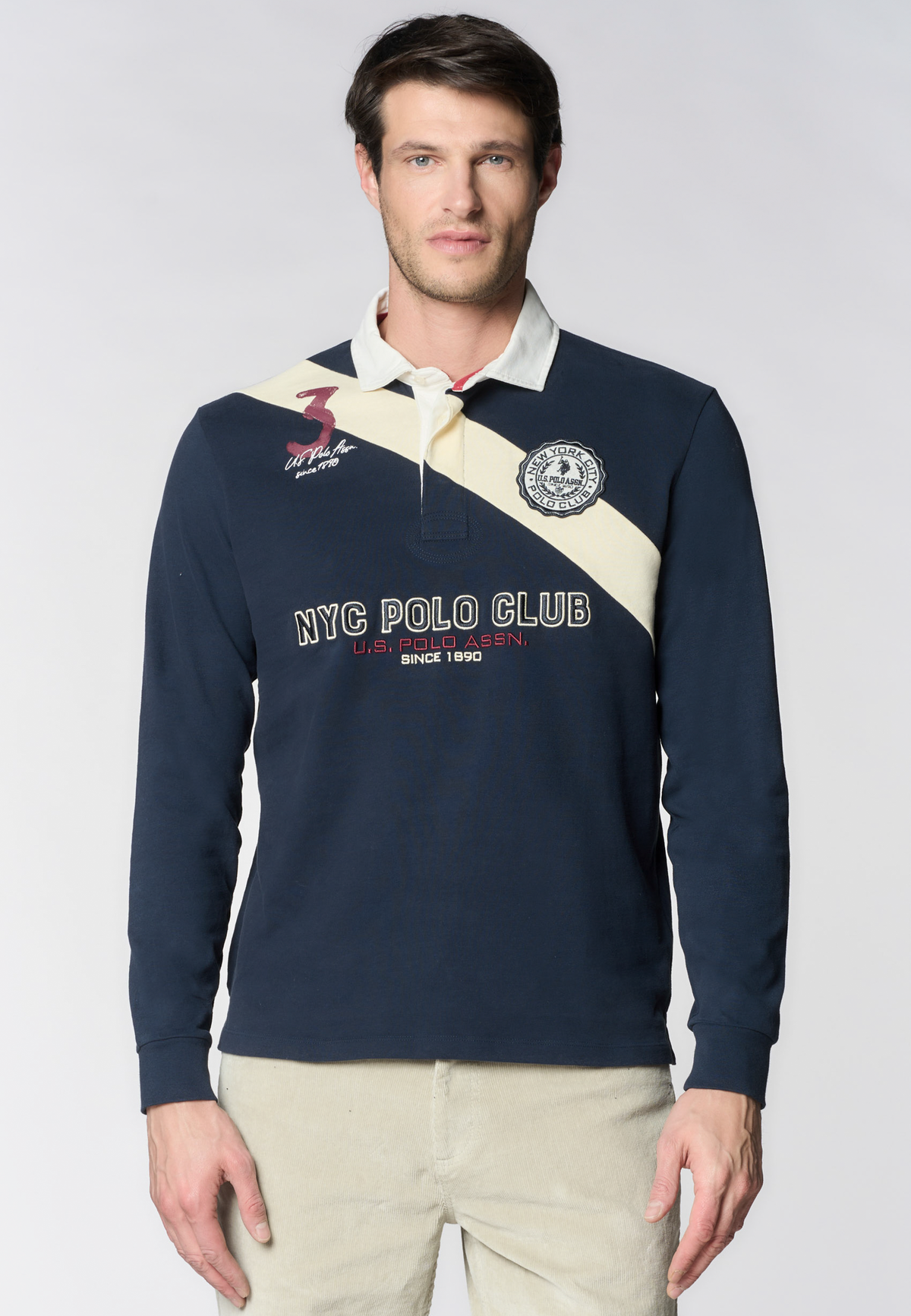Polo shirt a maniche lunghe in cotone con patch e ricami