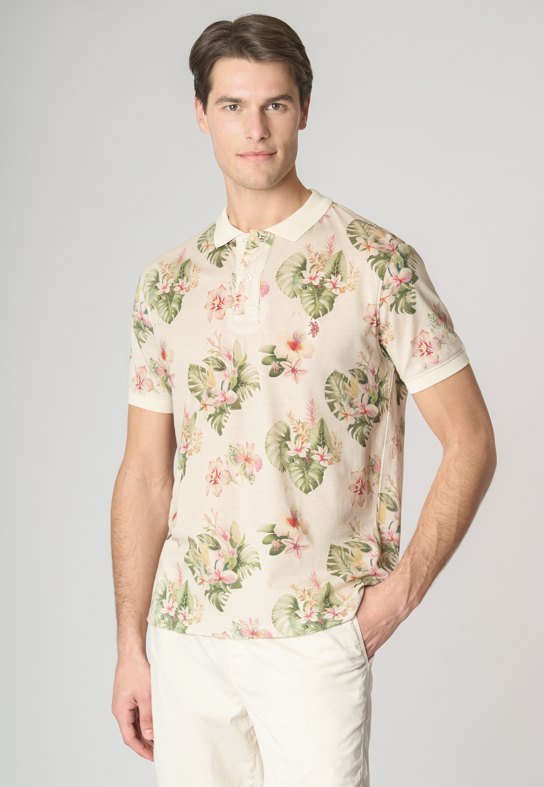 Polo shirt a maniche corte in cotone piquet con fantasia floreale e logo