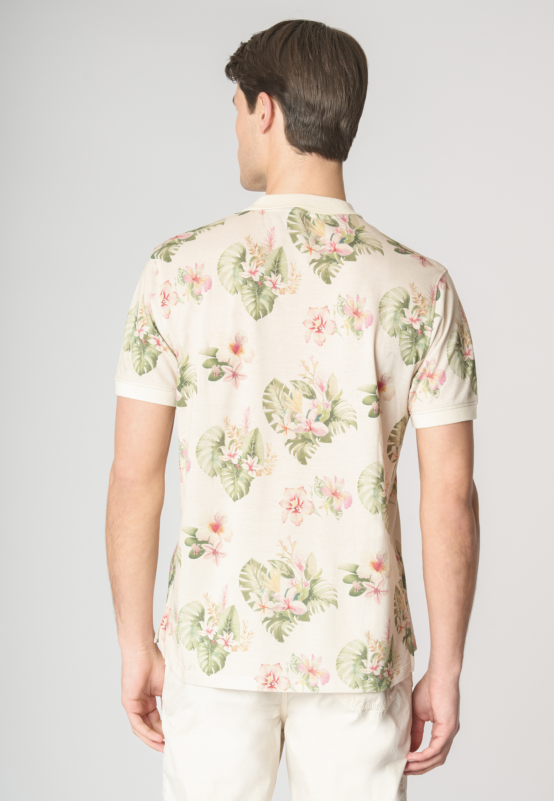 Polo shirt a maniche corte in cotone piquet con fantasia floreale e logo