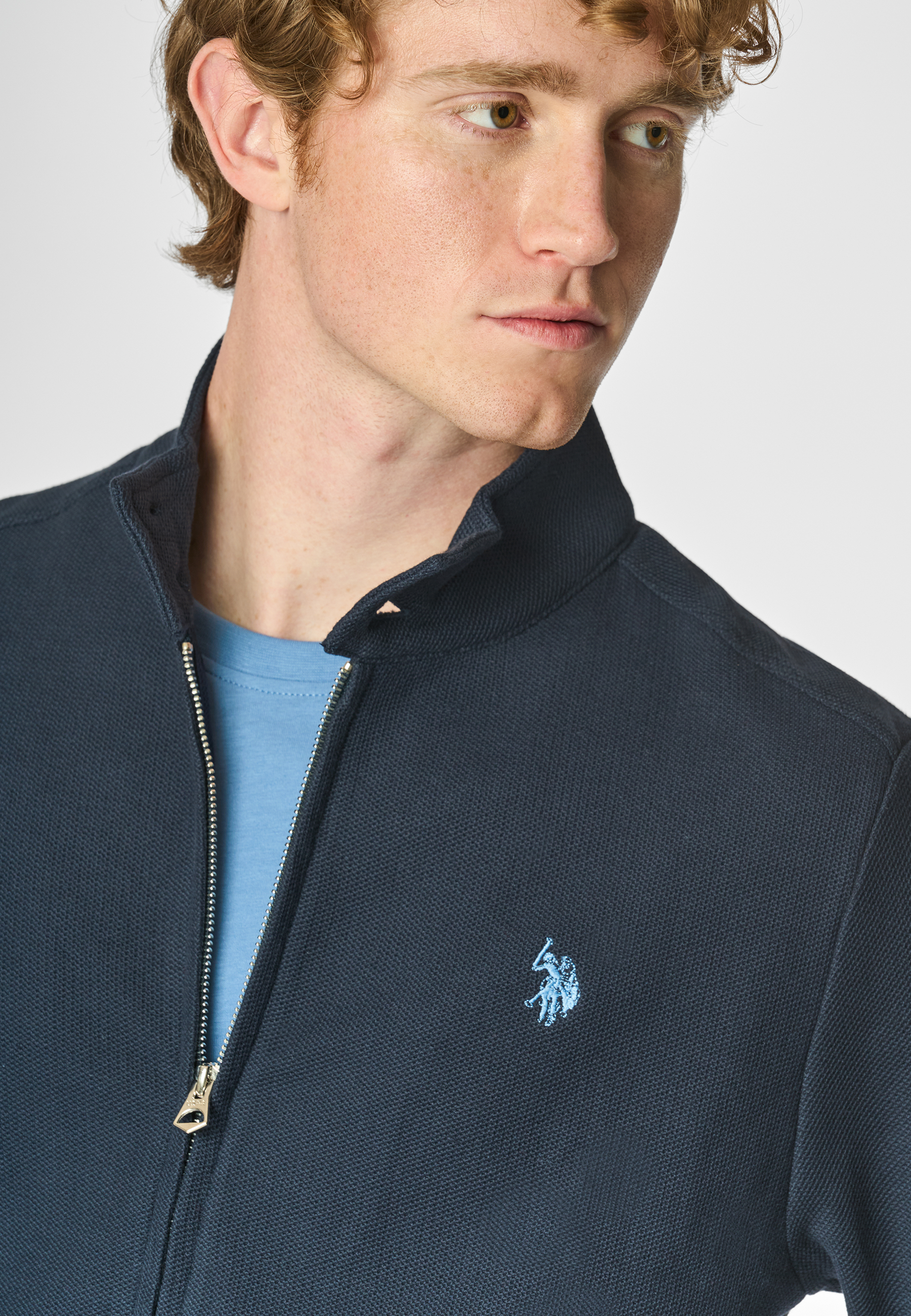 Felpa a collo alto in cotone piquet con interno tartan e chiusura zip