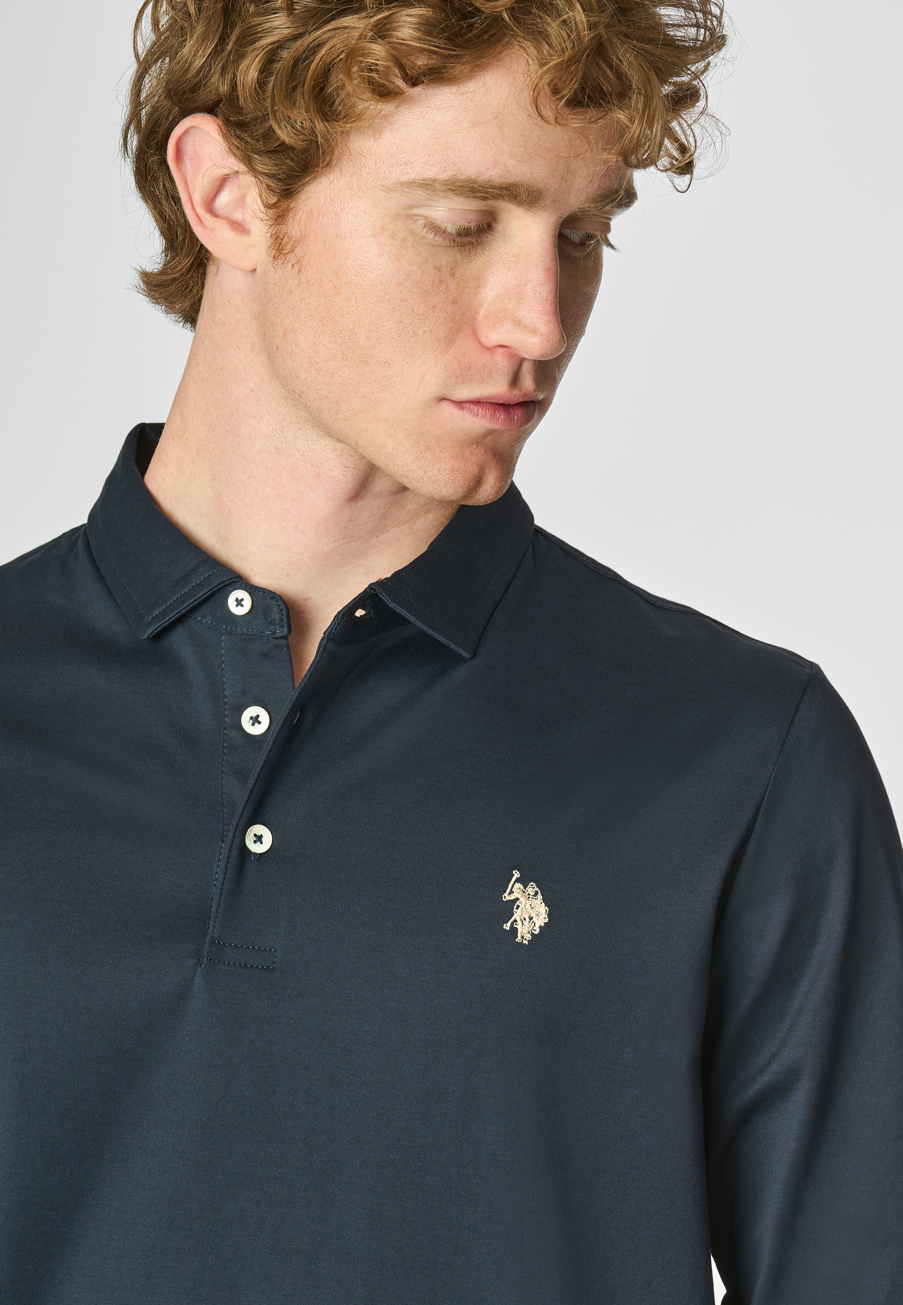 Polo shirt a maniche lunghe in cotone premium quality con logo e bottoni sulle maniche