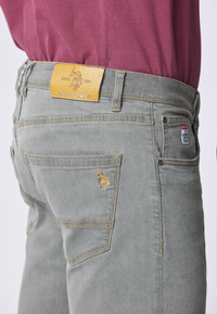 Pantalone denim cinque tasche tapered fit