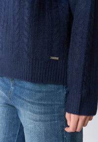 Maglia dolcevita lavorazione a spiga