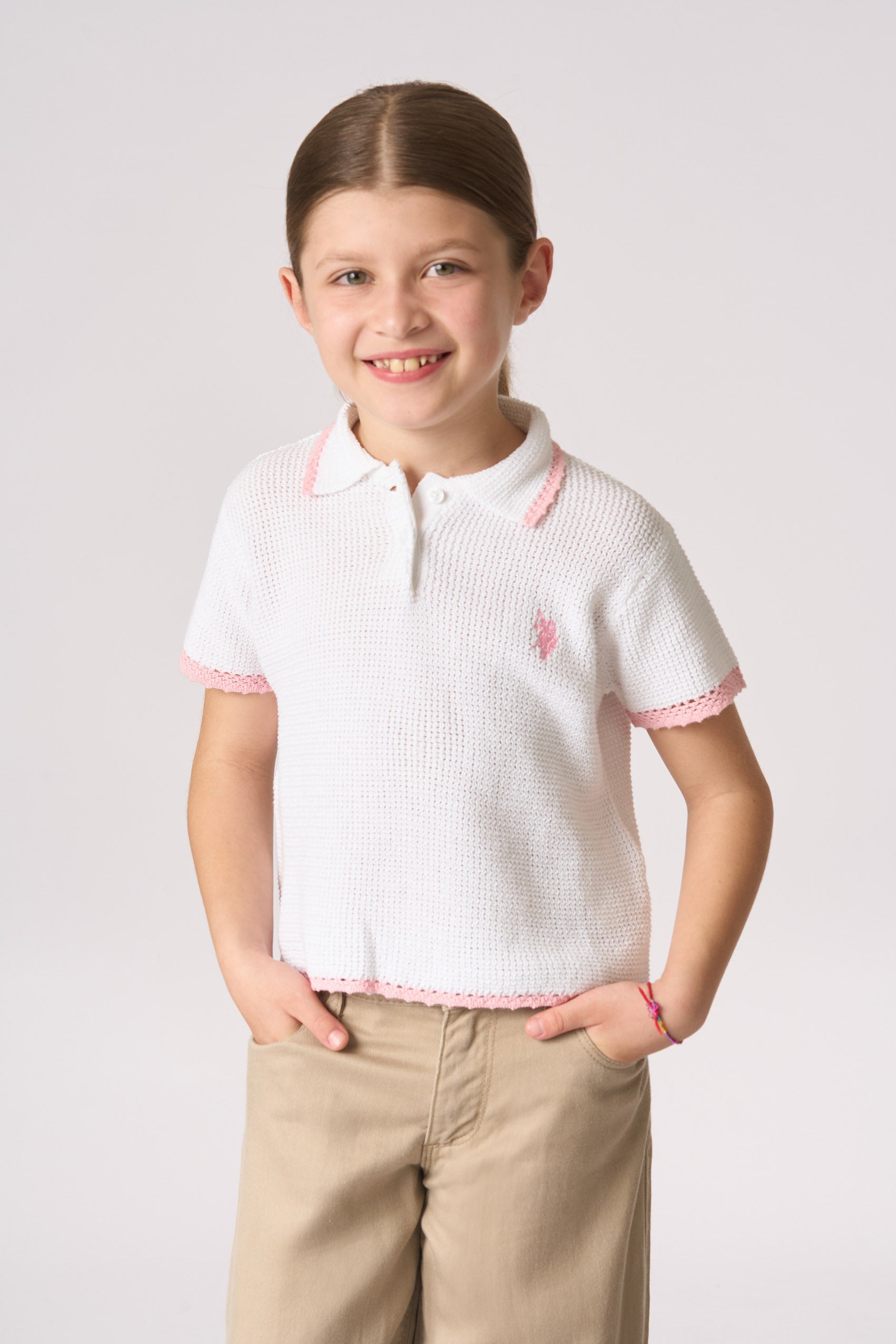 Polo shirt da bambina in maglia con lavorazione crochet
