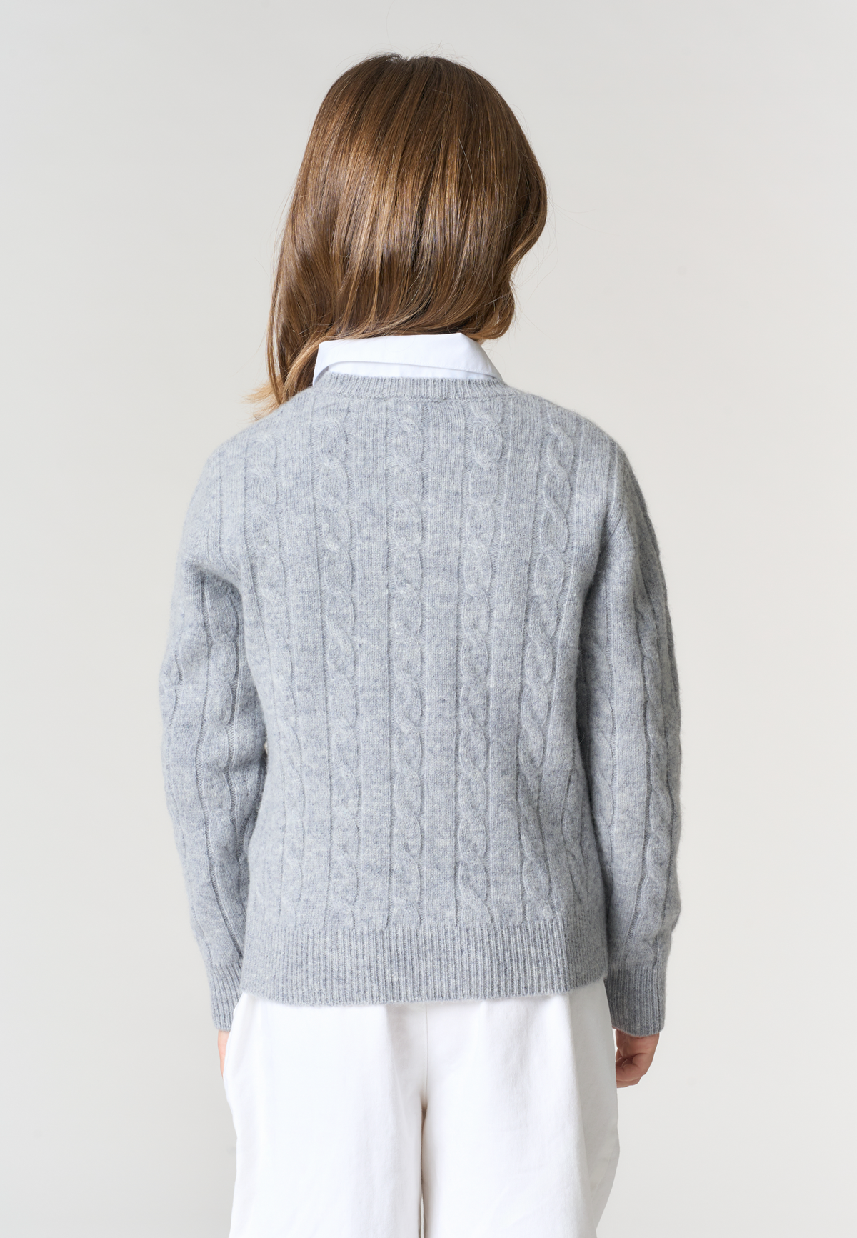 Maglia da bambina in lana con lavorazione a trecce