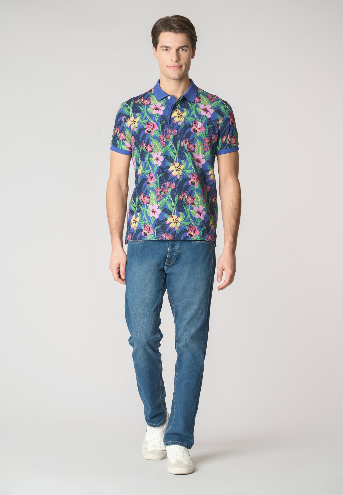 Polo a maniche corte in cotone piquet con fantasia tropicale e logo