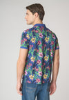Polo a maniche corte in cotone piquet con fantasia tropicale e logo
