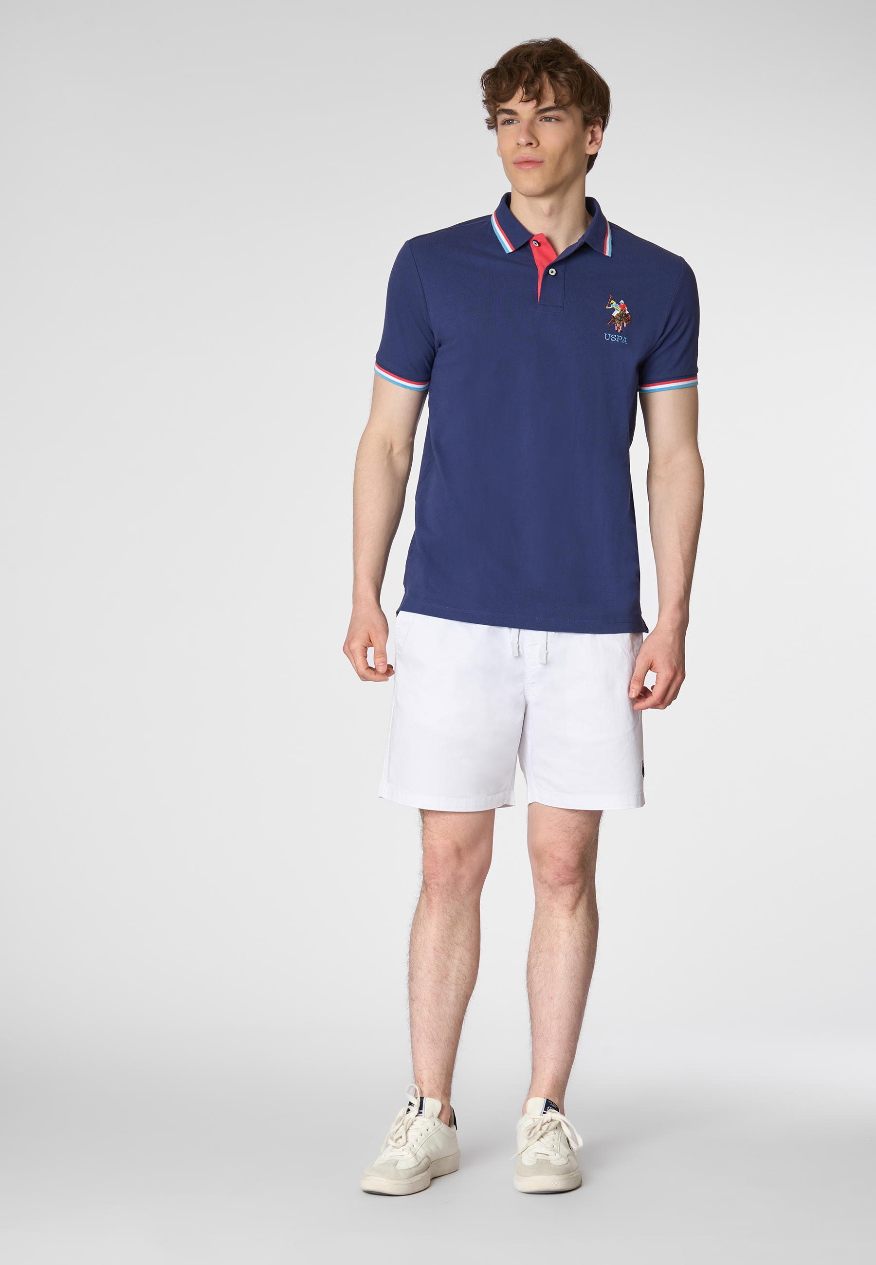 Polo shirt a maniche corte in cotone con logo colorato e dettagli rigati