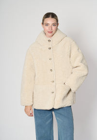 Giubbotto in soft sherpa con cappuccio